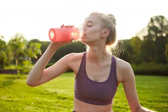 woman drinking protein
